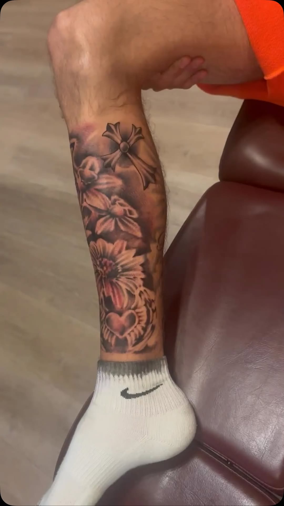 Floral and cross calf tattoo by Giani Martini