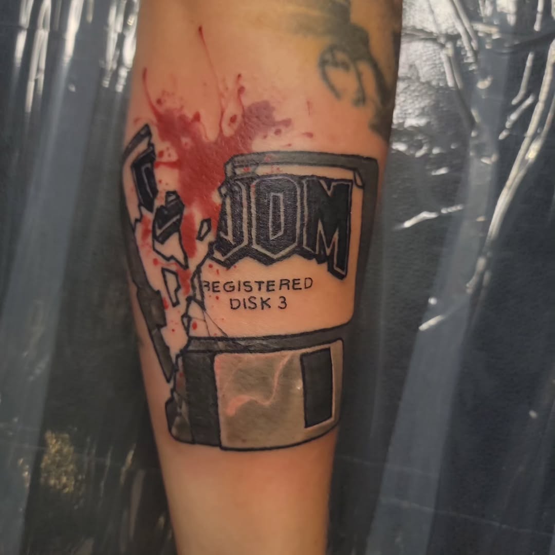 DOOM floppy disk tattoo by Ronnie Hicks
